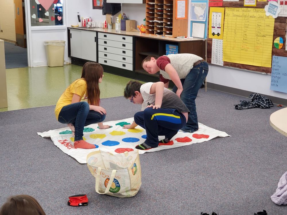 K-4 students enjoying Twister during recess on a snowy morning in Unity!